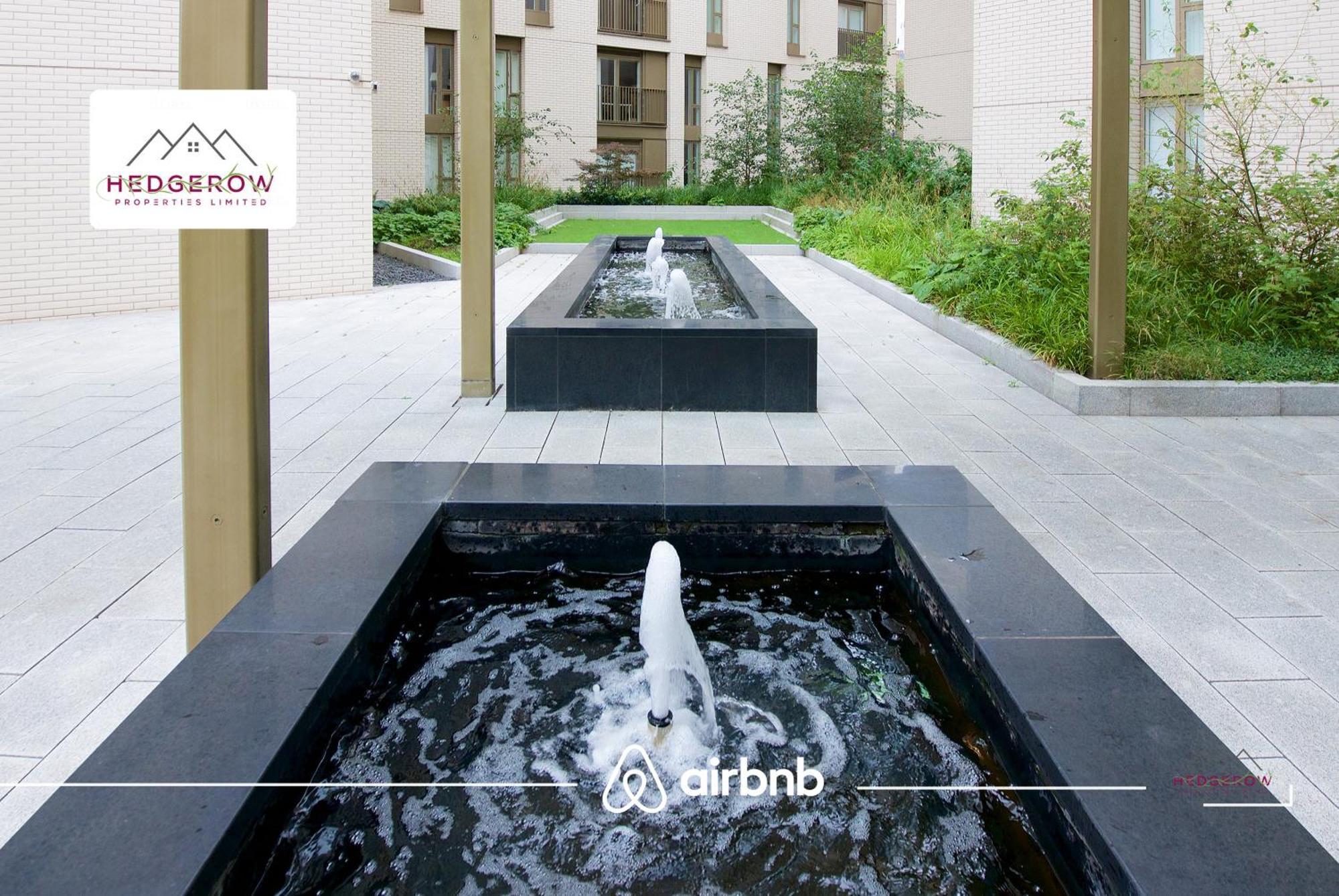 Apartment Centre By Hedgerow
